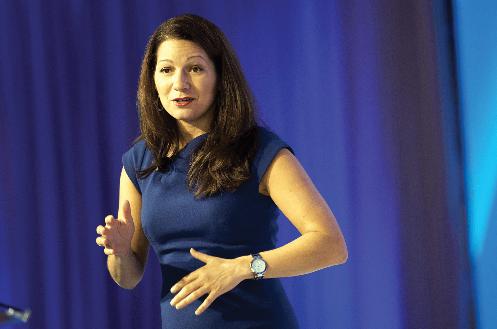 Allison Shapira onstage in blue dress